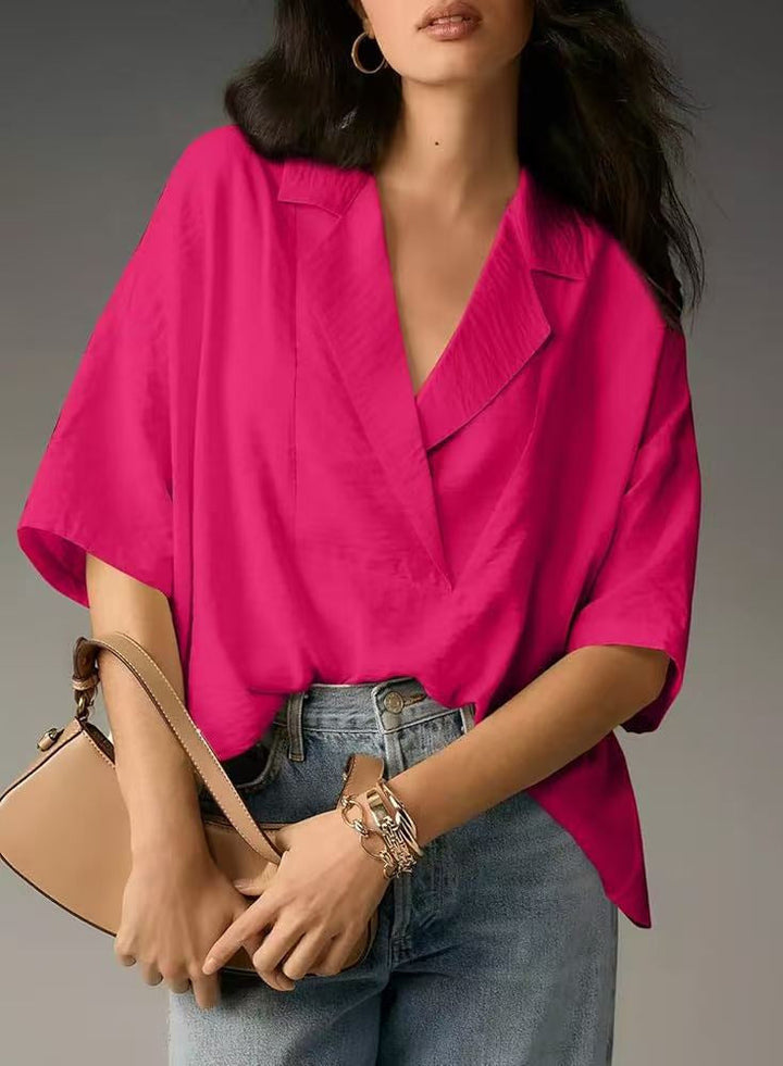 Fashionable women's chic V-neck blouse. Elegant long sleeve top in a comfortable loose fit.