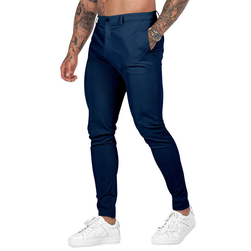 Detail: Comfortable waistband & button closure on men's slim-fit stretch trousers for a secure fit.