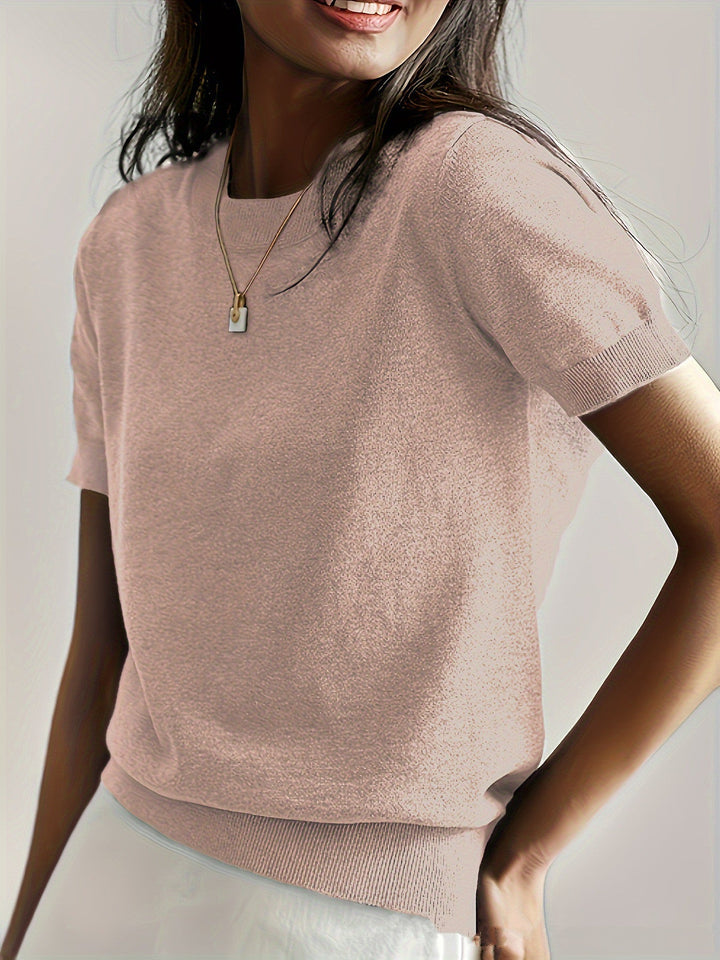 Fashionable women's short sleeve knit sweater, offering both comfort and style.