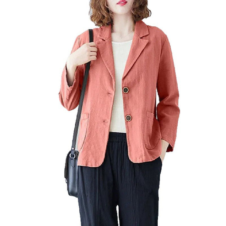 Detailed view of women's elegant casual blazer, highlighting stylish contrast buttons and tailored fit.
