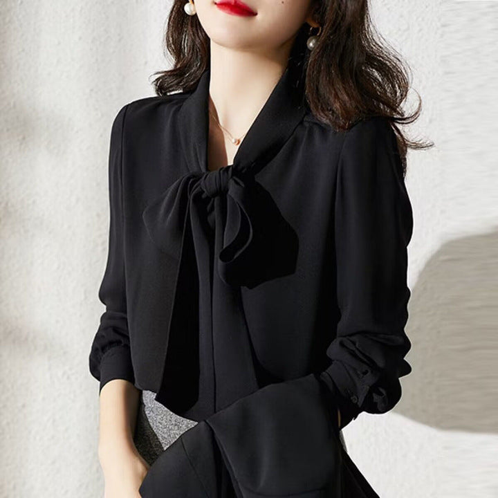 Sophisticated black women's top with an elegant bow, a classic and chic blouse for all occasions.