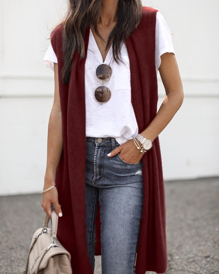 Full-length shot of a women's elegant long casual vest, showcasing its sleek, modern, sleeveless design.