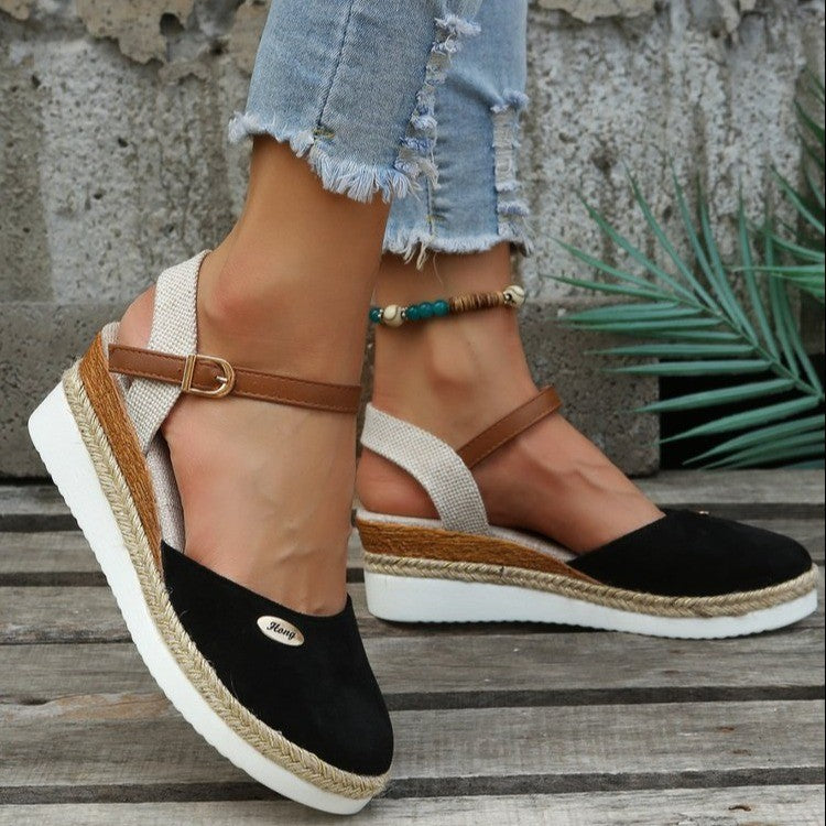 Close-up of the woven strap design on comfortable women's wedge sandals, showcasing craftsmanship.