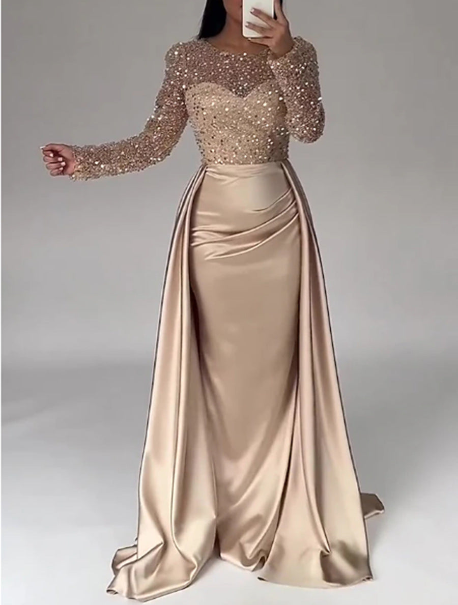 Flattering women's glitter long-sleeve evening gown. Elegant formal dress for a dazzling look.