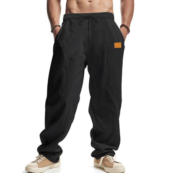 Everyday men's casual pants featuring a drawstring waist and convenient side pockets.