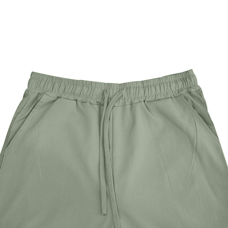 Relaxed fit men's joggers, ideal for home wear. Breathable fabric, elastic waist, and side pockets for comfort.
