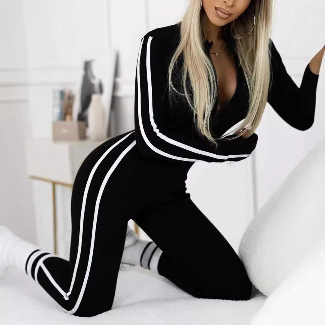 Athletic women's long sleeve striped bodysuit, ideal gym wear and sleek leisurewear.