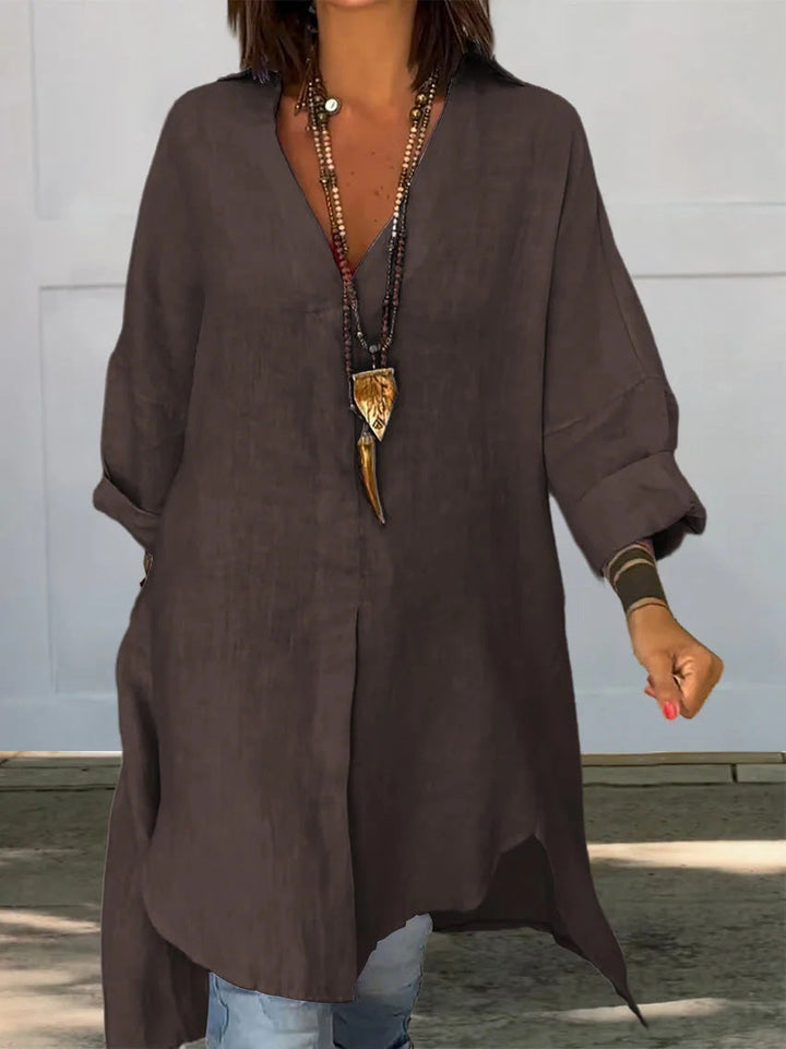 Modern women's collared button-down blouse, a versatile top with roll-up sleeves for a chic casual look.
