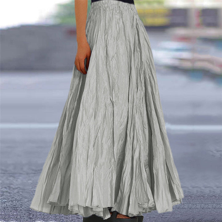Long pleated A-line skirt for women, featuring a comfortable elastic waist and flowing design.