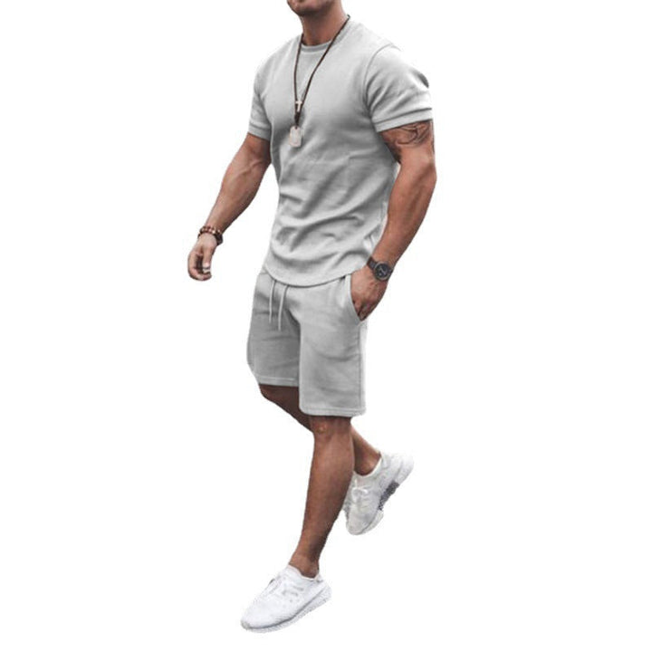 Black men's activewear set, a modern breathable tee & shorts combo for sports.