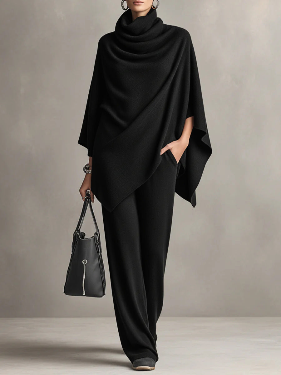 Elegant black women's two-piece set featuring a draped top & wide-leg pants. Chic and comfortable for any occasion.