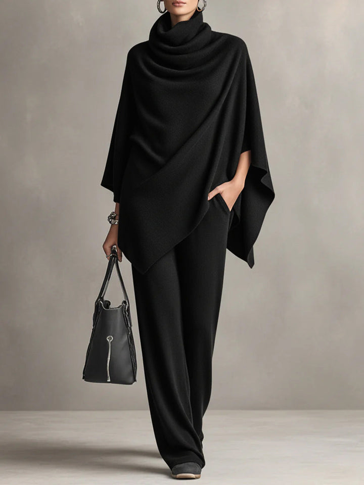 Elegant black women's two-piece set featuring a draped top & wide-leg pants. Chic and comfortable for any occasion.