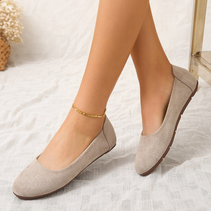 Versatile women's slip-on comfort slippers with a soft upper and non-slip sole, great for all-day wear at home.