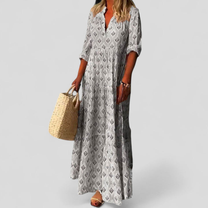 Chic women's maxi dress featuring a vibrant ethnic pattern. Elegant long sleeve design, versatile for spring/summer fashion.