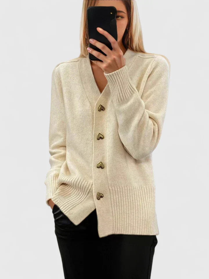 Chic women's elegant cardigan with heart buttons. A cozy, long sleeve layering piece for versatile autumn fashion.