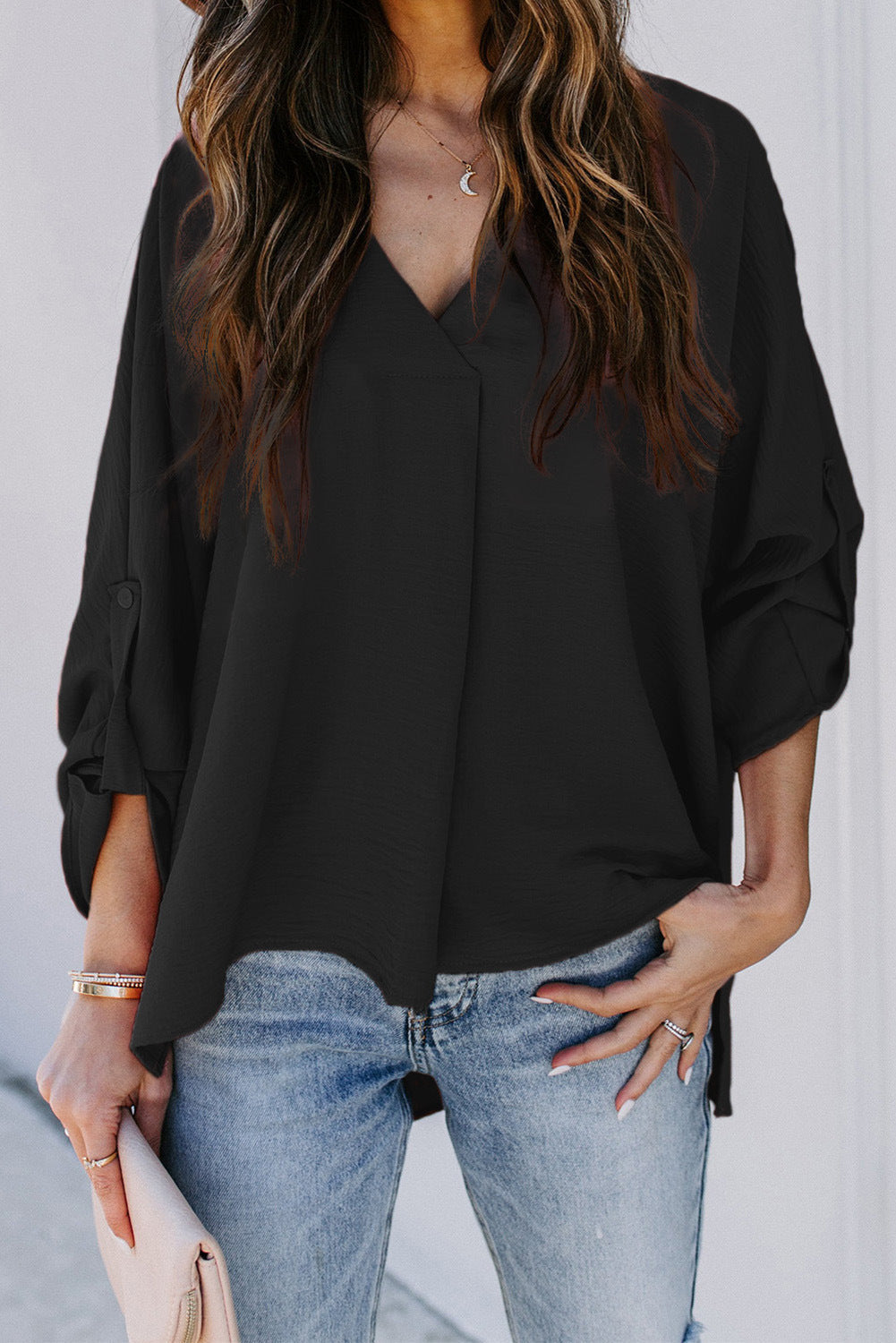 Colorful women's V-neck casual top, short sleeve, relaxed fit for comfortable summer fashion.
