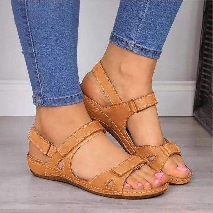 On-foot view of women's ergonomic strappy sandals, showcasing their comfortable fit and fashionable summer look.