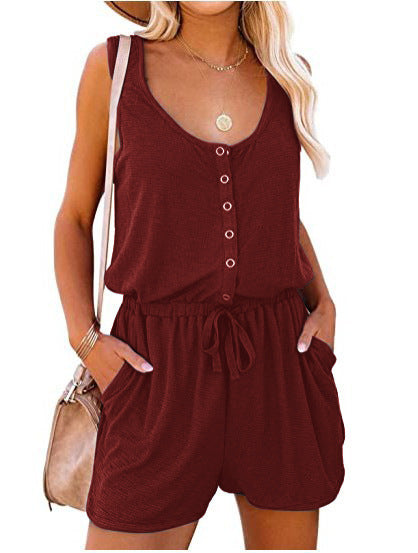 Woman modeling a stylish sleeveless buttoned jumpsuit with pockets, showcasing its comfortable & chic summer design.
