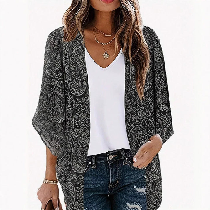 Women's trendy black kimono jacket with elegant pattern, perfect for casual or stylish layered outfits.