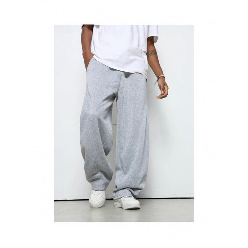 Men's loose athletic jogging pants with practical side pockets for active & casual use.