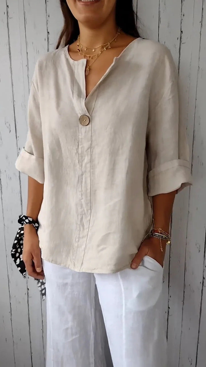 Chic women's loose-fit button-up shirt with adjustable roll-up sleeves, perfect for versatile everyday style.