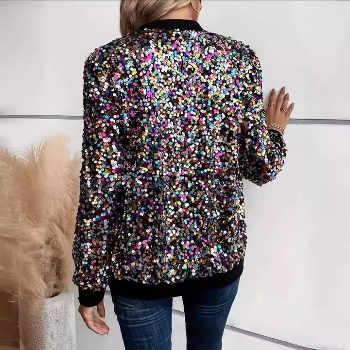 Close-up of women's sequin embellished functional jacket showcasing comfortable cuffs and glitter detail.