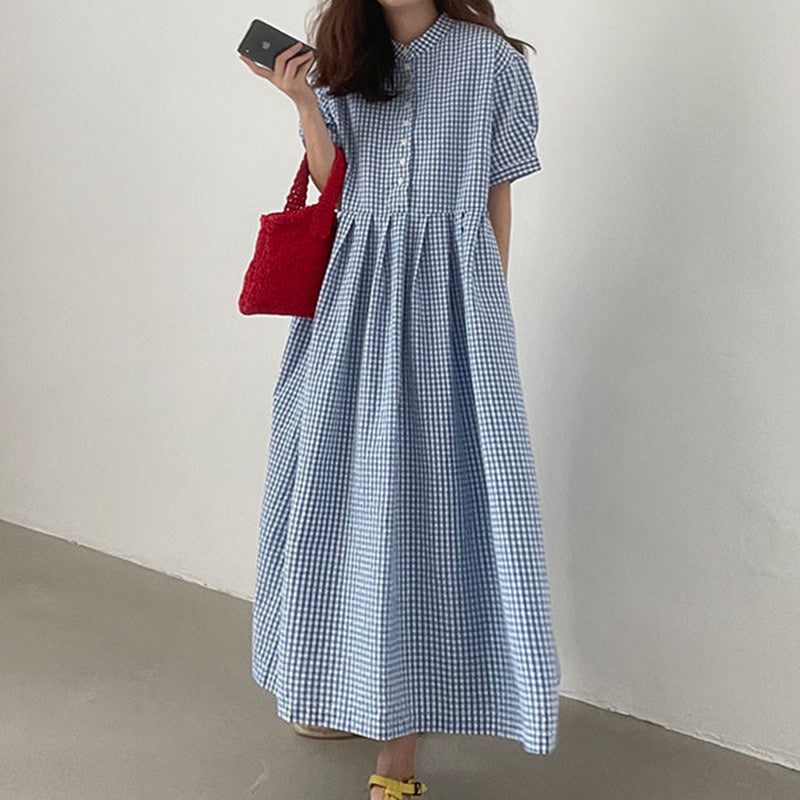 Casual women's checkered short sleeve A-line dress, offering a flattering and comfortable fit for summer.