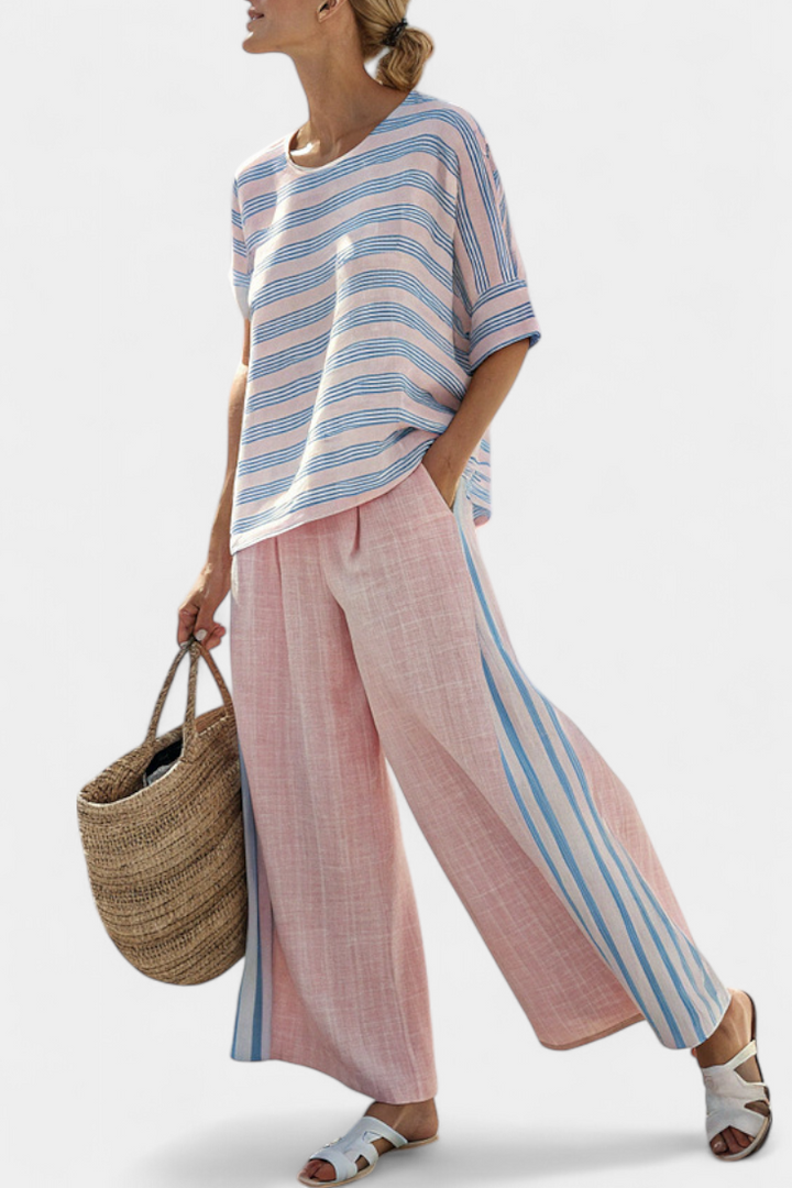 Elegant women's striped two-piece set with long-sleeve blouse and wide-leg pants, perfect for resort wear.