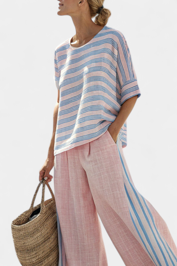 Women's pastel striped blouse and pants set in pink & blue, a relaxed fit two-piece for summer vacation.