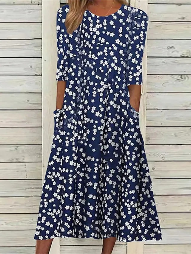 Stylish women's elegant floral midi dress, a beautiful spring outfit with discreet and practical pockets.