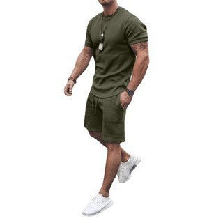 Men's summer casual wear: a white breathable t-shirt and black athletic shorts.