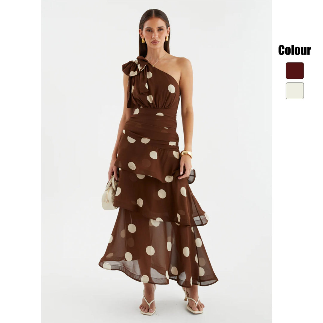 Elegant women's asymmetrical one-shoulder polka dot maxi dress with a voluminous, flowy skirt for special occasions.