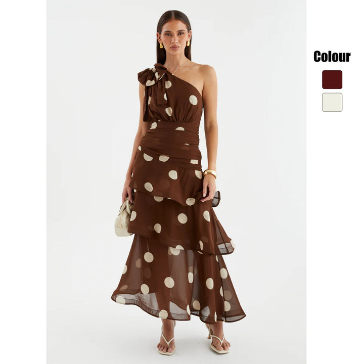 Elegant women's asymmetrical one-shoulder polka dot maxi dress with a voluminous, flowy skirt for special occasions.