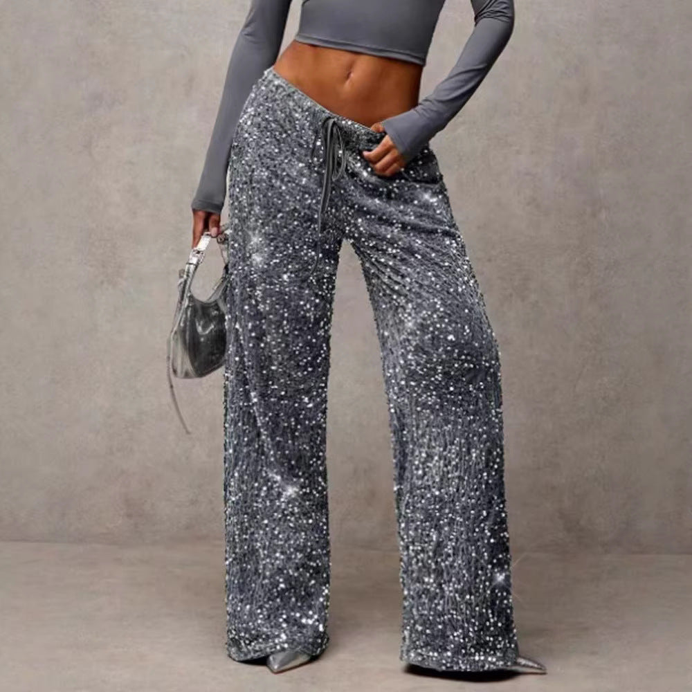 Women's elegant sequin palazzo pants, sparkling wide-leg design for party wear.
