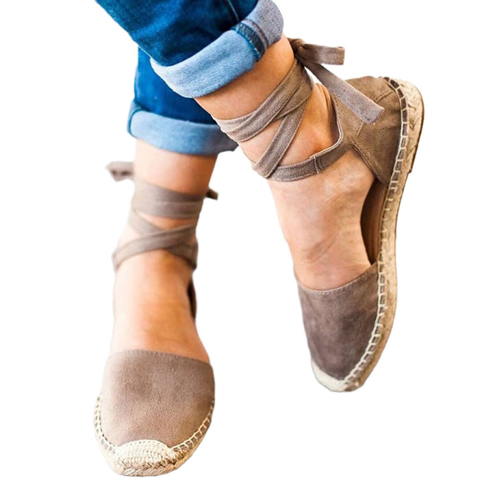 Chic women's espadrille shoes with secure tie-straps, providing comfortable and stylish summer footwear.