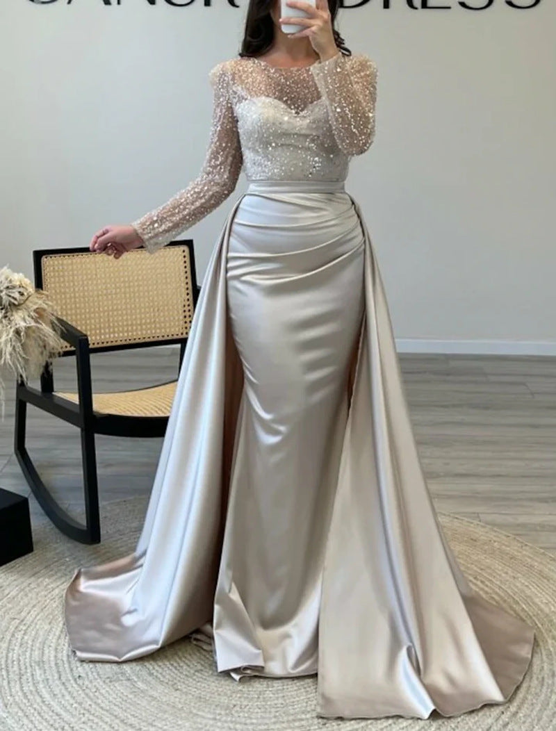Sophisticated women's shimmering long-sleeve formal gown. Elegant evening wear for galas & parties.