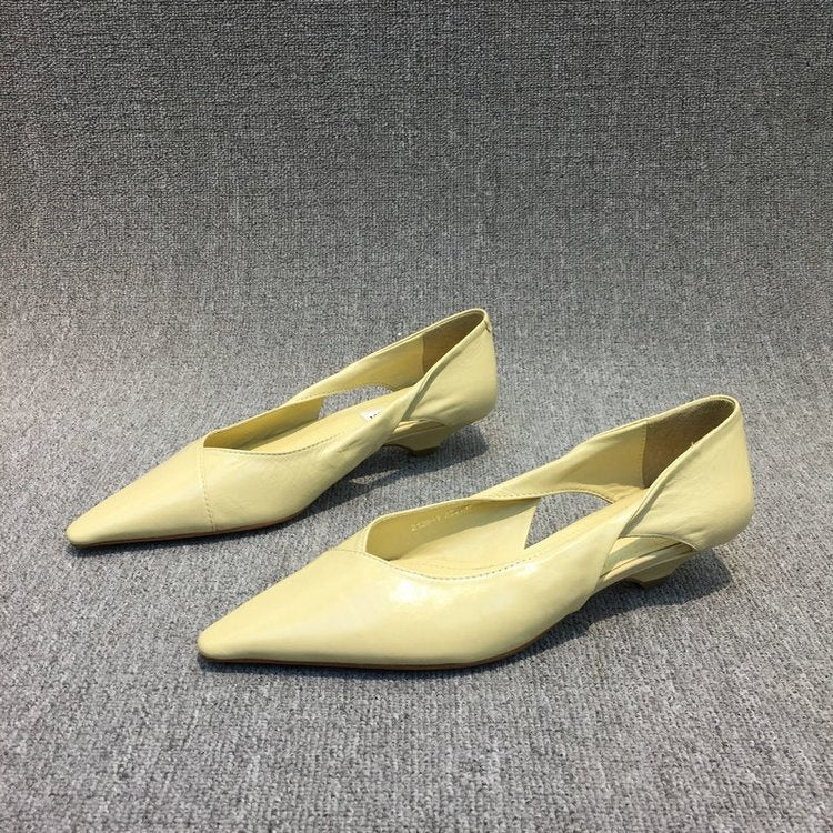 Professional women's pointed toe ballet flats for office wear, providing all-day comfort.