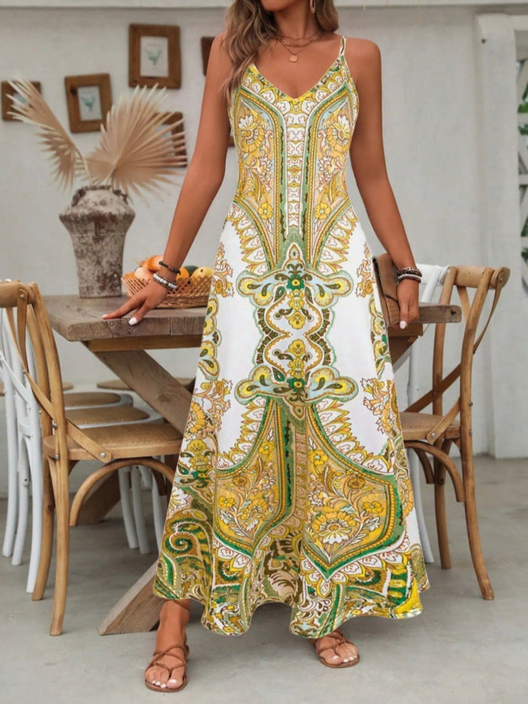Full length women's boho maxi dress, featuring a beautiful paisley print and elegant flowy design for comfort.