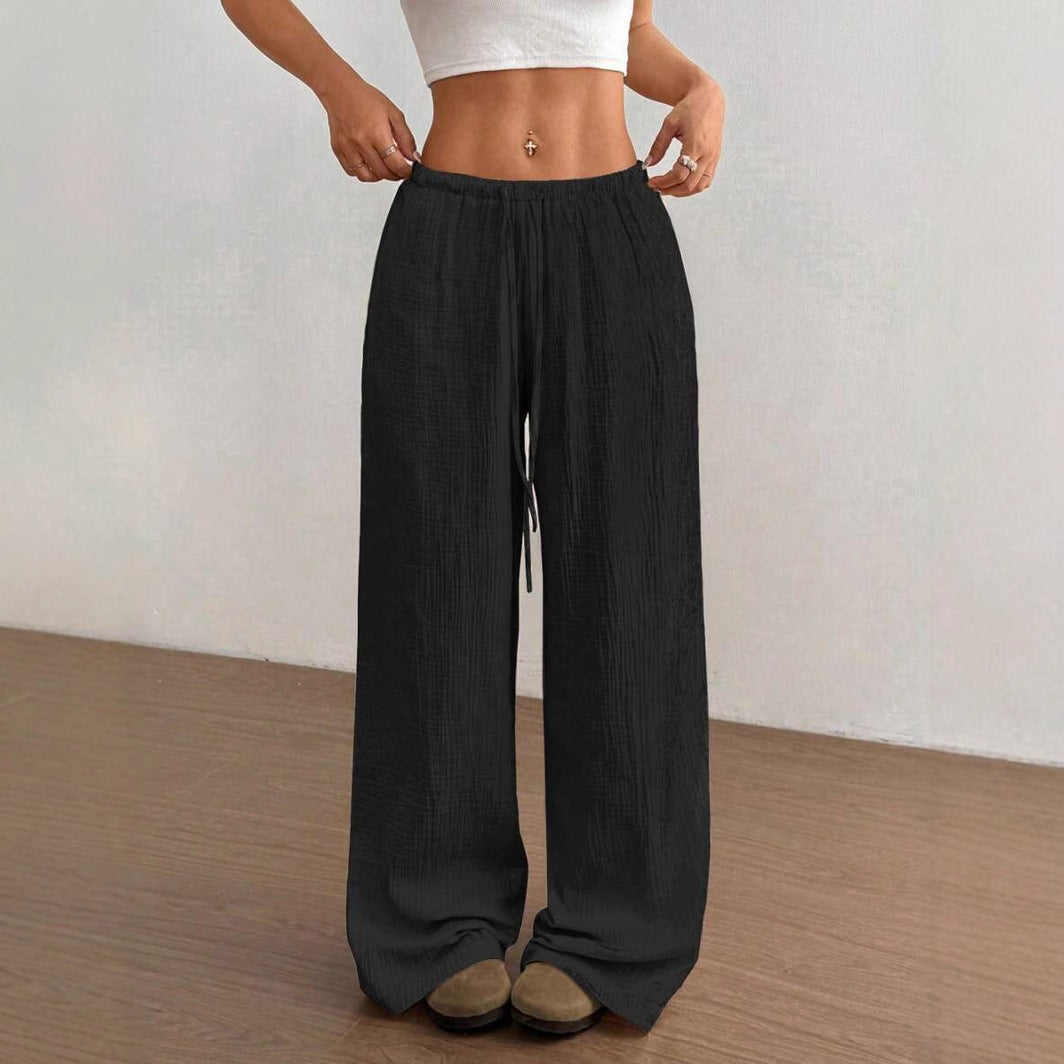 Elegant flowy wide leg trousers for women. Comfortable, relaxed fit, perfect for casual summer fashion.