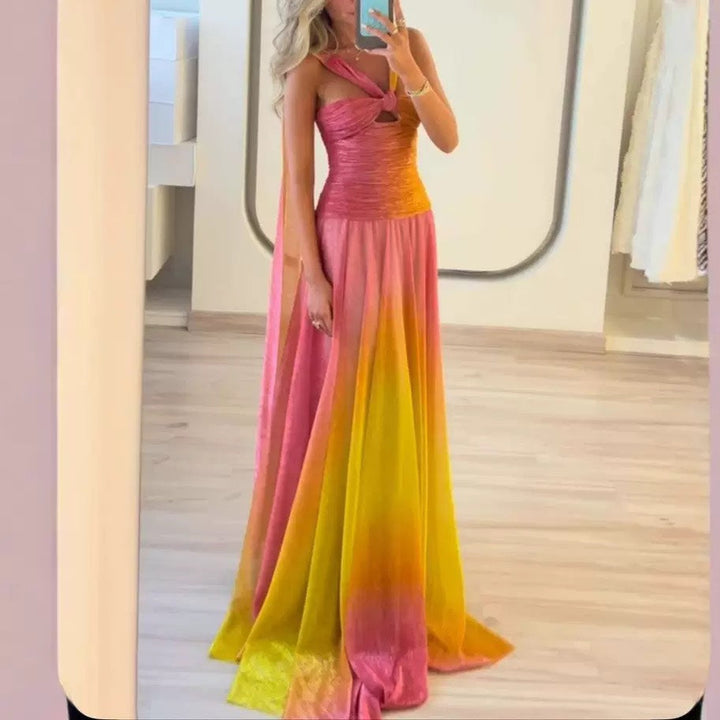 Elegant women's flowing maxi dress with delicate straps, perfect for evening wear or a special occasion.