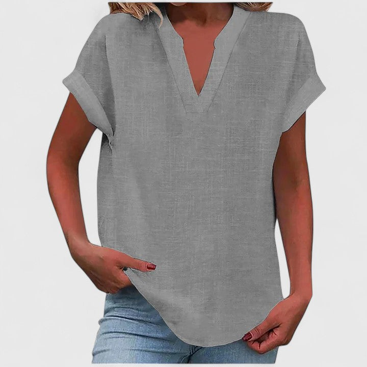 Versatile women's V-neck blouse, suitable for casual, work, or smart-casual looks.