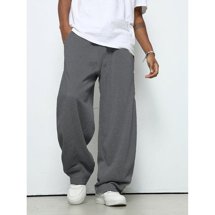 Modern men's loose fit jogging pants, combining streetwear style with athletic comfort for everyday fashion.