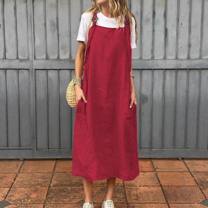 Versatile women's summer A-line dress, sleeveless, featuring handy pockets & adjustable straps.