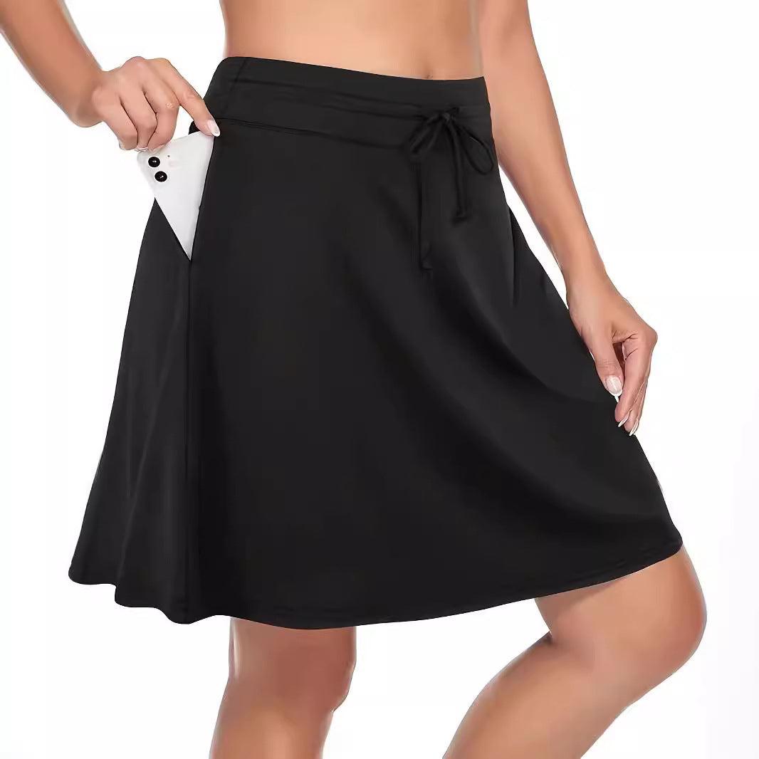 Women's running skirt with integrated compression shorts for support. Quick-dry gym apparel for active workouts & sports.