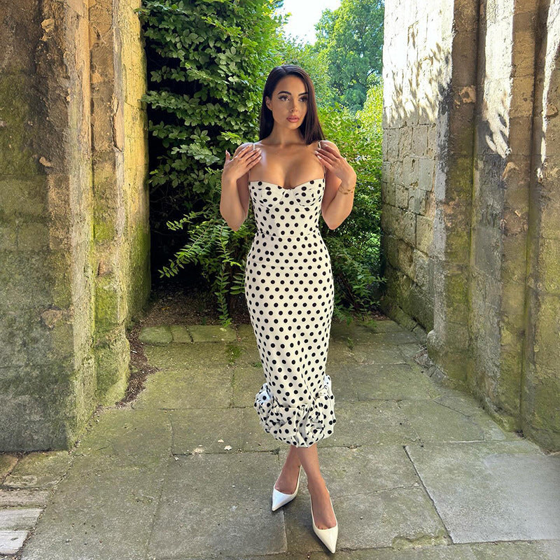 Comfortable & chic women's polka dot midi dress, featuring an elegant voluminous hem for spring & summer wear.
