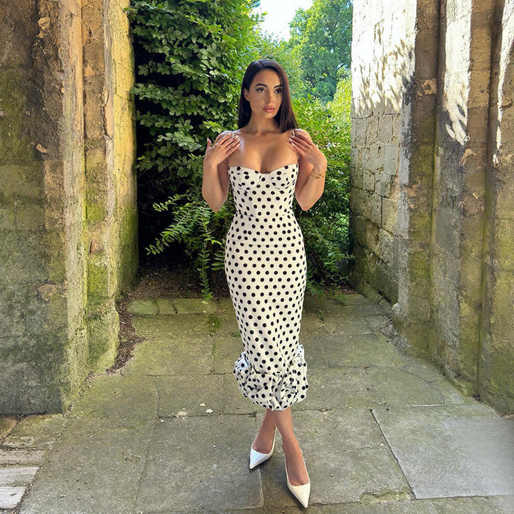 Comfortable & chic women's polka dot midi dress, featuring an elegant voluminous hem for spring & summer wear.