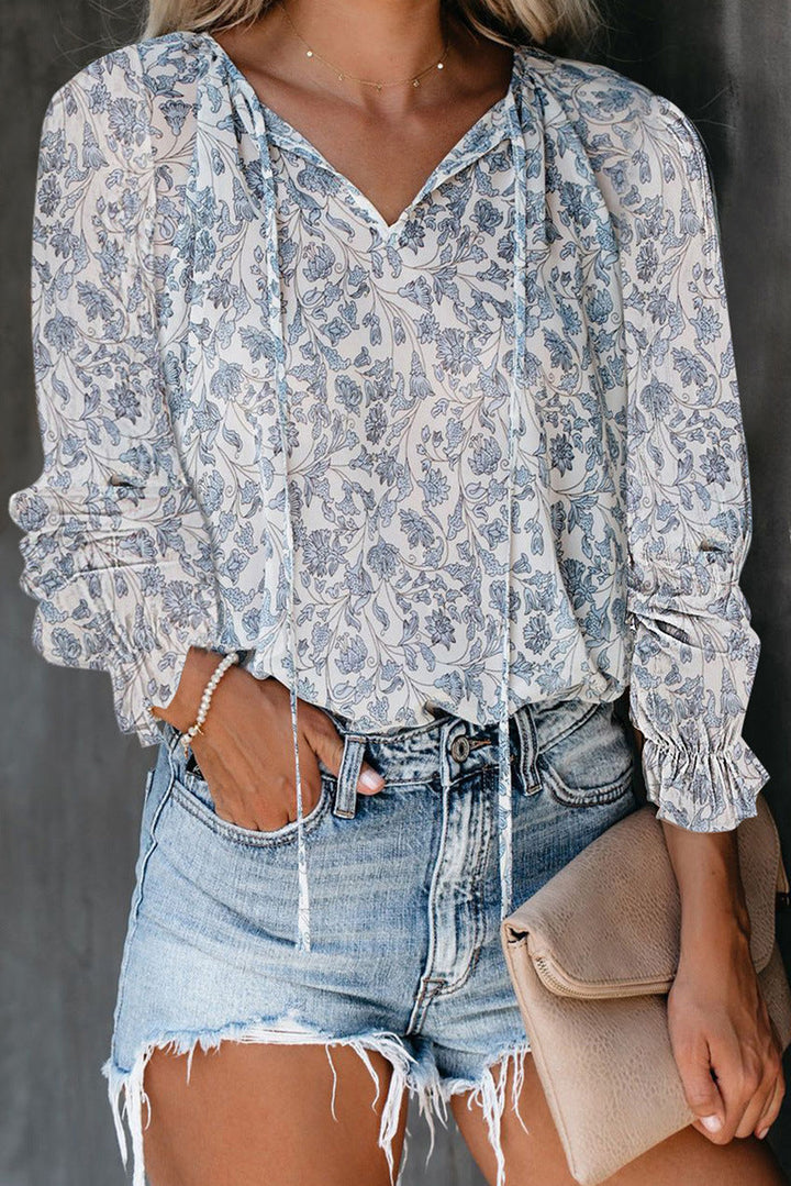 Chic women's ruffle V-neck summer blouse, comfortable and elegant for any occasion.