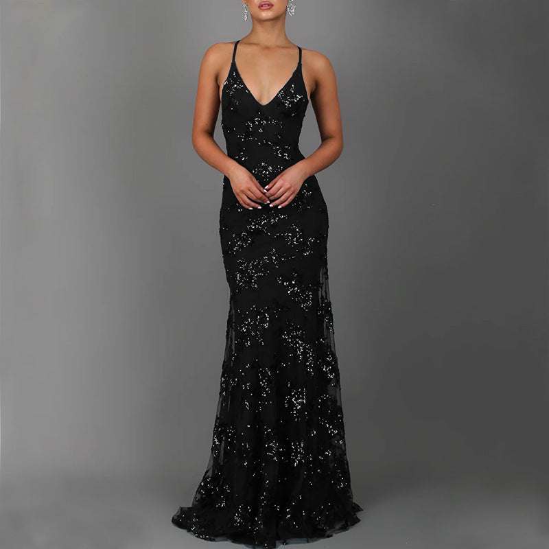 Women's sparkling formal dress for proms & galas. Features a deep back and elegant front slit.