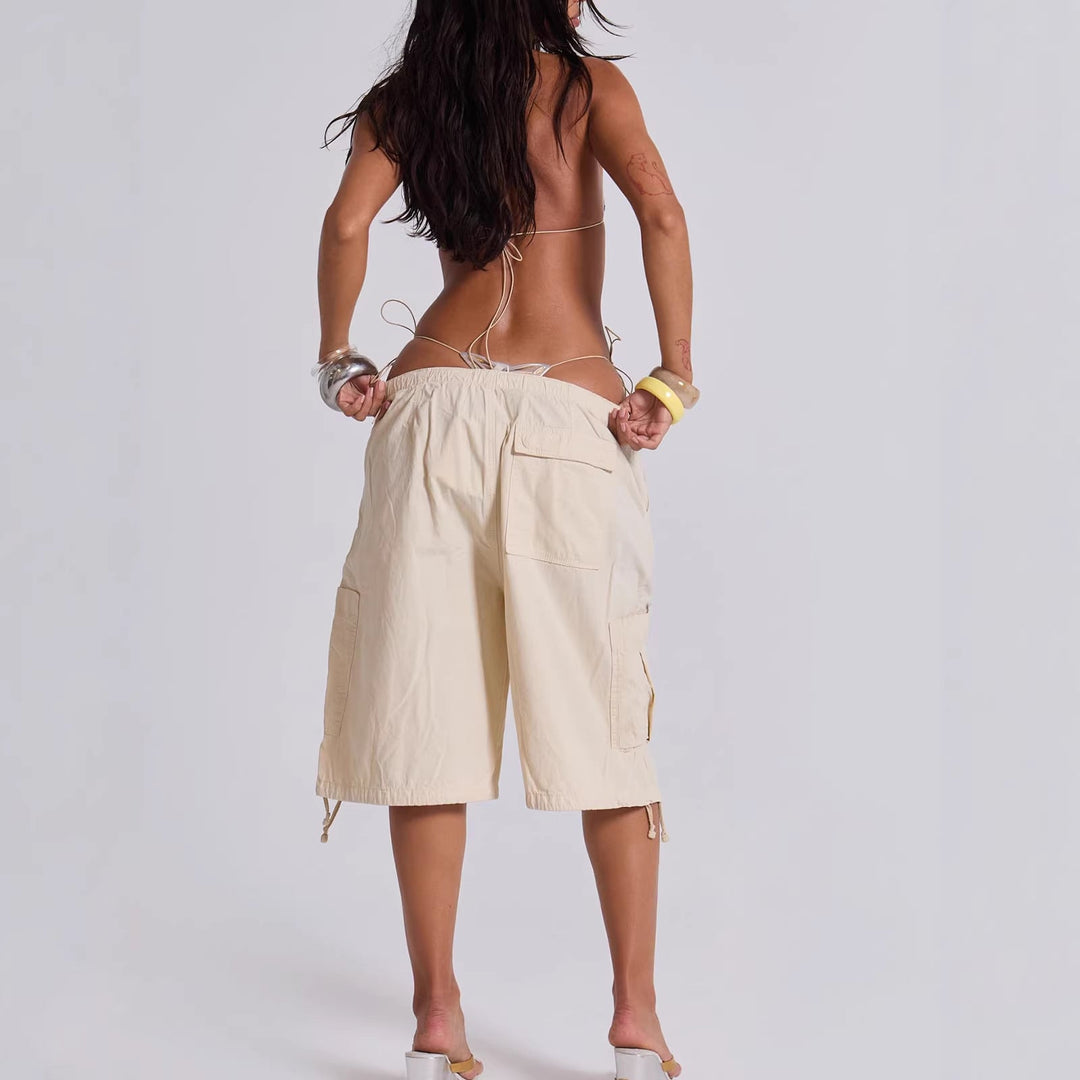 Relaxed fit women's cargo shorts, perfect for warm weather. Features comfortable fabric & functional utility pockets.