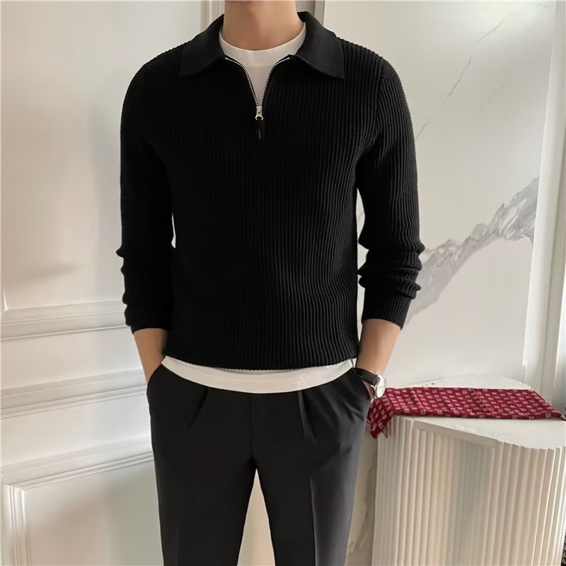 Close-up of men's zip-up polo sweater. Featuring textured knit for smart casual fall & winter style.